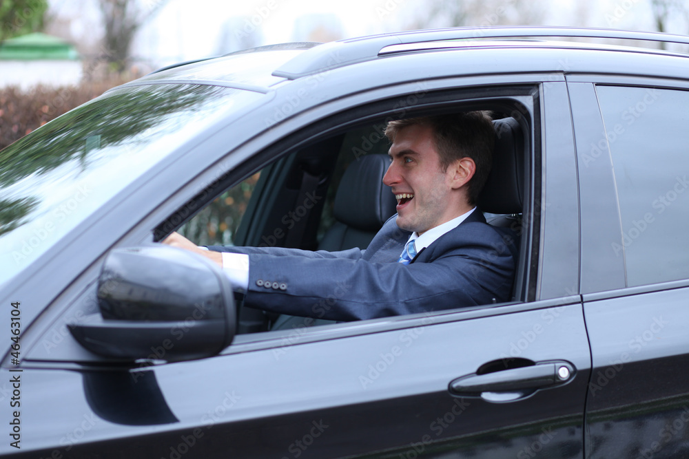 young attractive man young man in the car