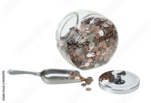 Glass Jar Full of Coins with a Metal Scoop