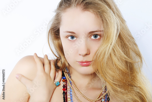 Portrait of the beautiful girl in costume jewellery
