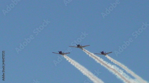 Retro propeller airplanes flying in formation