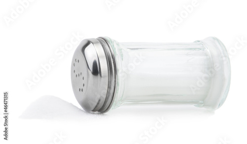 Glass saltcellar with salt on white background photo