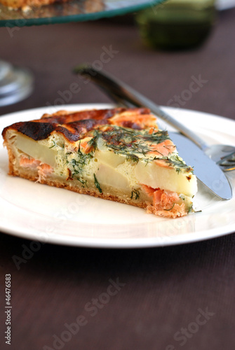 Piece of Salmon, dill and potato tart.