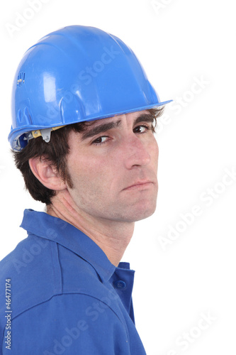 A unhappy manual worker.