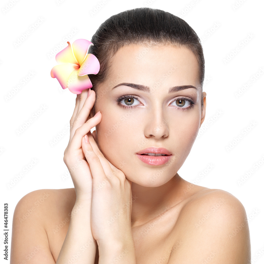 Beauty face of young woman with flower. Beauty treatment concept Beauty face of young woman with flower. Beauty treatment concept