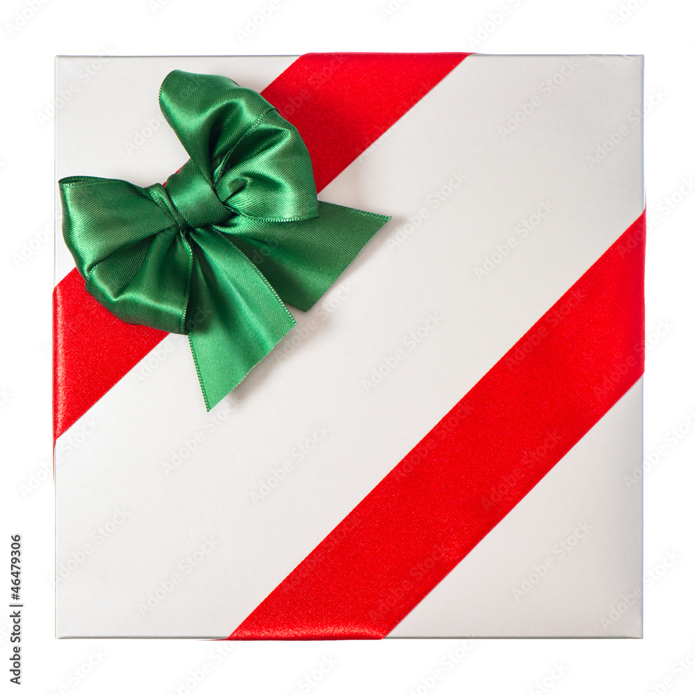 red ribbon with green bow on grey gift box red ribbon with green bow on grey gift box