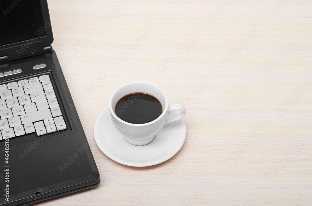 laptop with fresh cup of coffee and notebook laptop with fresh cup of coffee and notebook