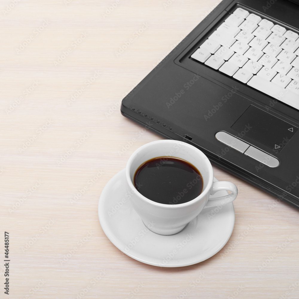 laptop with fresh cup of coffee and notebook laptop with fresh cup of coffee and notebook