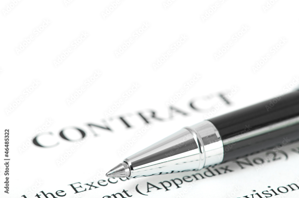 Close-up of silver pen on contract. Close-up of silver pen on contract.