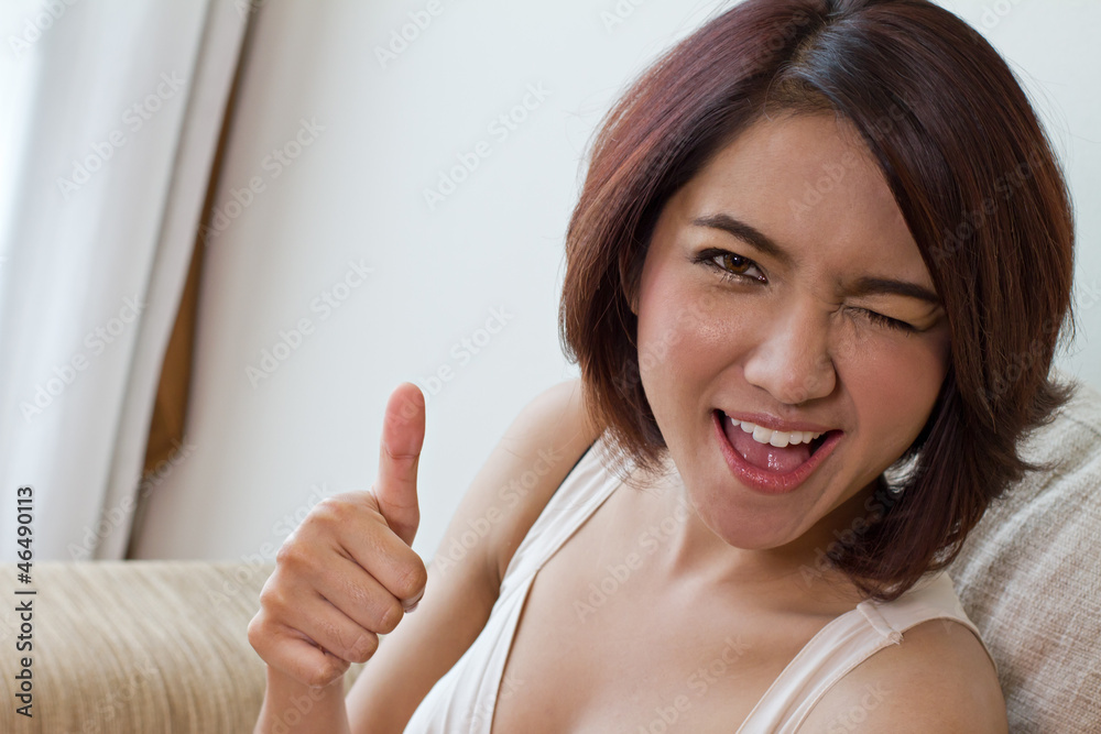 woman giving thumb up with happy emotion woman giving thumb up with happy emotion