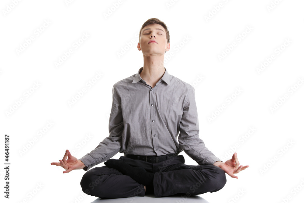 Businessman sitting in lotus position Businessman sitting in lotus position