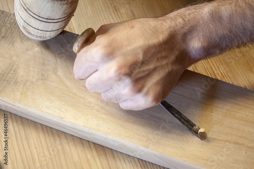 gouge wood chisel carpenter tool working wooden background