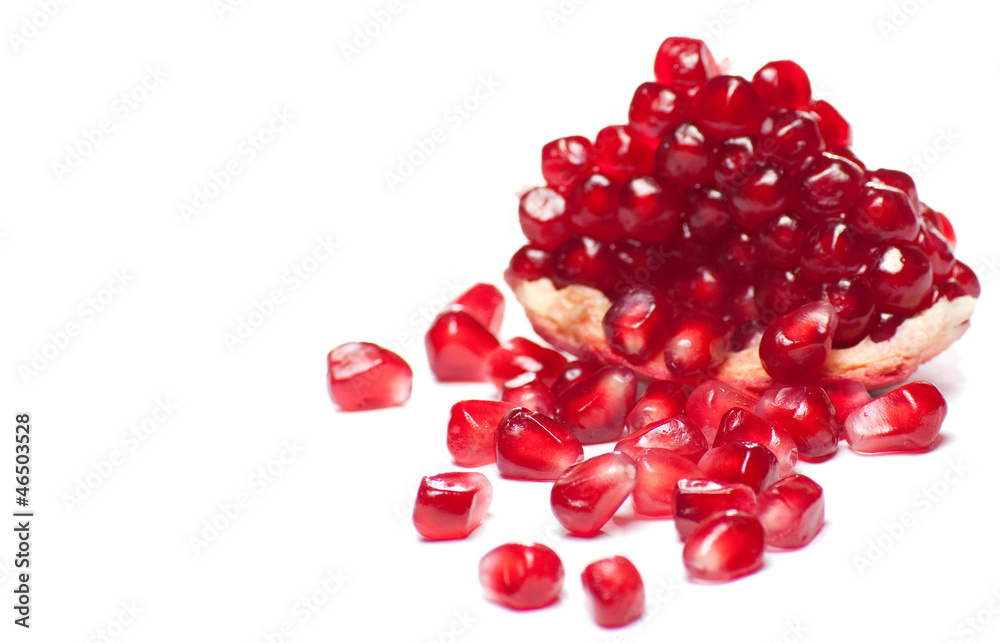Ripe pomegranate piece isolated on white background Ripe pomegranate piece isolated on white background