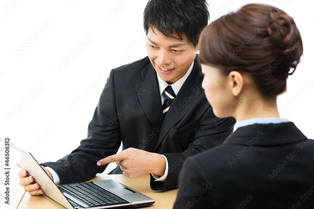 Young asian smiling businesswoman and businessman Young asian smiling businesswoman and businessman