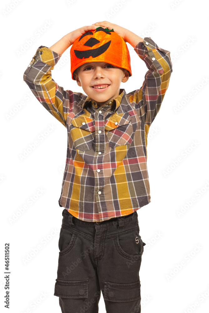 Fototapeta premium Cheerful boy with pumpkin hat