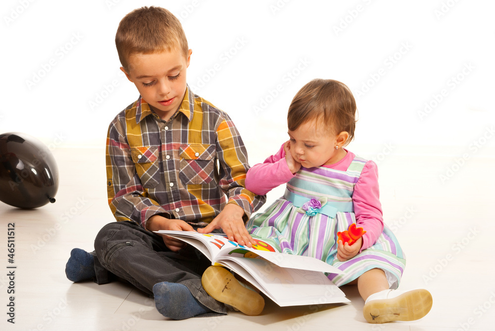 Brother teaching his sister Brother teaching his sister