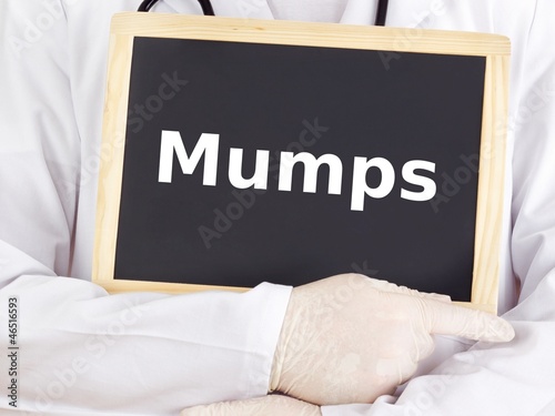 Photos Doctor shows information on blackboard: mumps