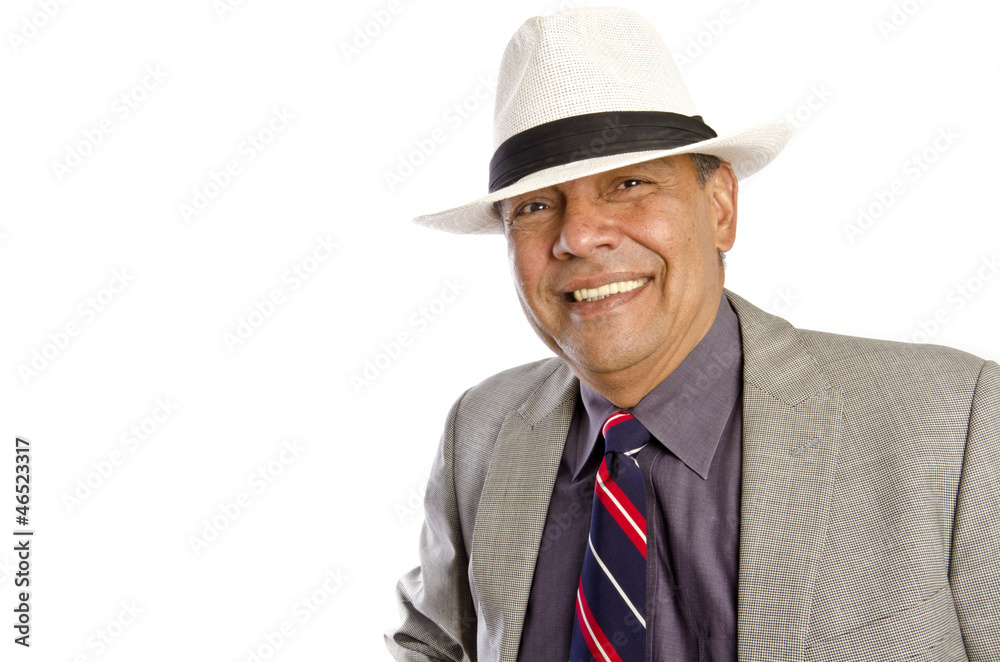 Handsome Hispanic Man in Suite and White Cuban Hat Smiling Handsome Hispanic Man in Suite and White Cuban Hat Smiling