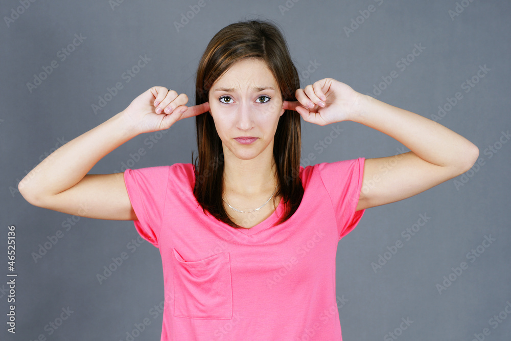 Young woman not wanting to hear Young woman not wanting to hear