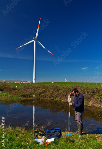 A scientist measuring water quality