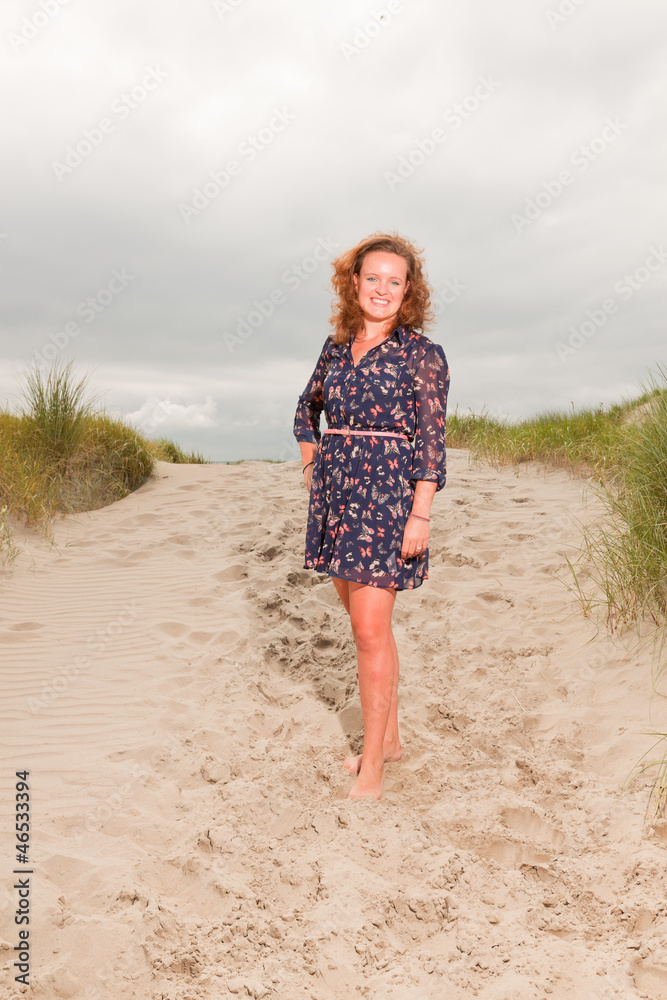 Pretty young woman enjoying outdoor nature near the beach. Pretty young woman enjoying outdoor nature near the beach.