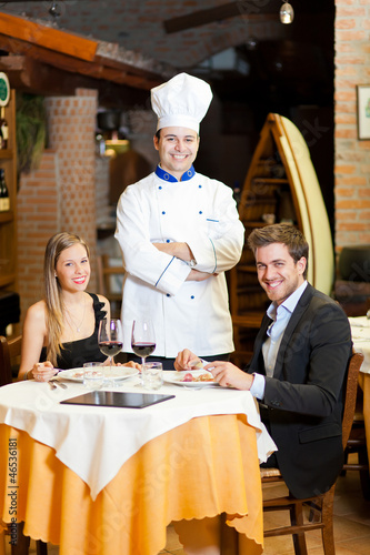 Couple at restaurant ordering from the waiter