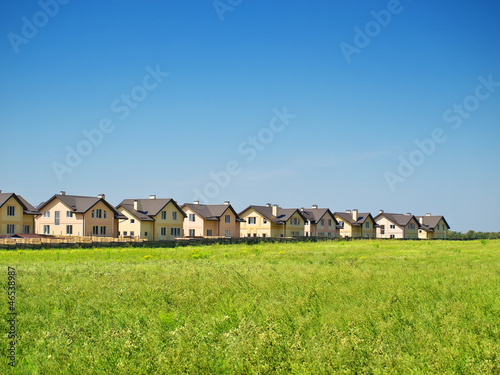 Group of houses in the countryside. Sunny summer day