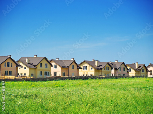 Group of houses in the countryside. Sunny summer day