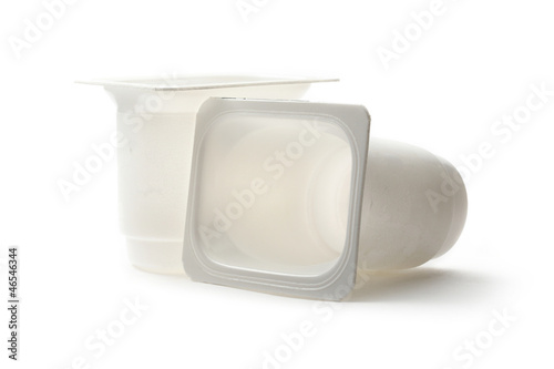 Empty plastic yoghurt pots on white