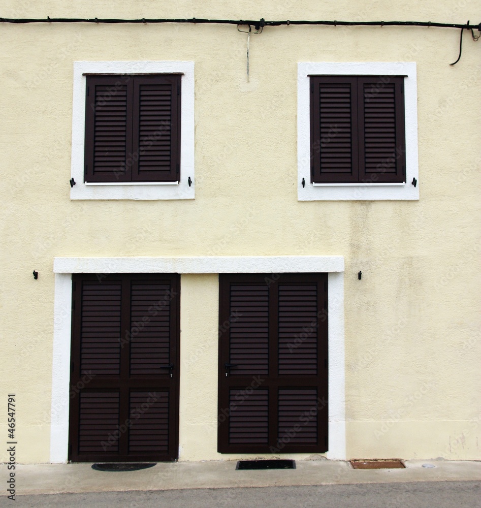 House with shutters in front view