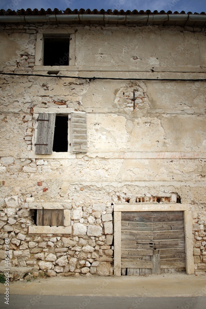 Old abandoned stone house in front view Old abandoned stone house in front view