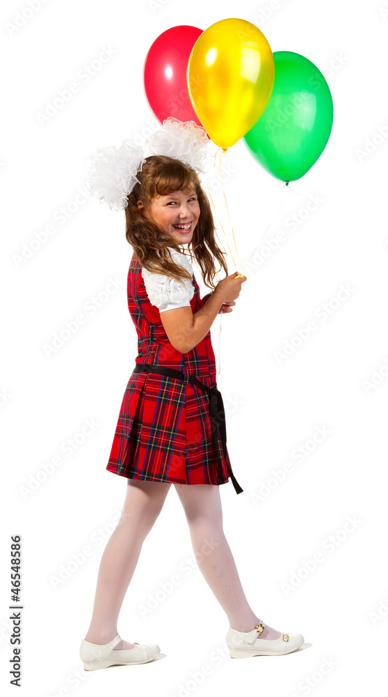 Happy school girl with colorful balloons in his hand