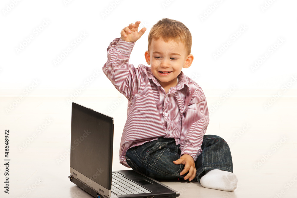 Happy toddler boy using laptop Happy toddler boy using laptop