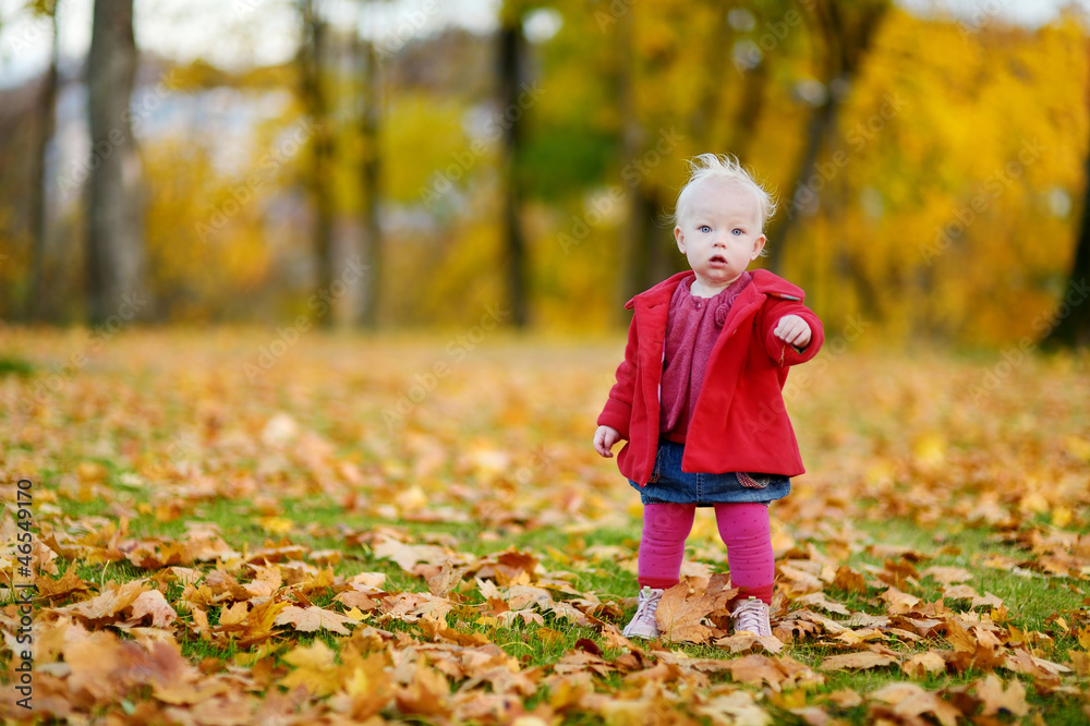 Adorable girl having fun on an autumn day Adorable girl having fun on an autumn day