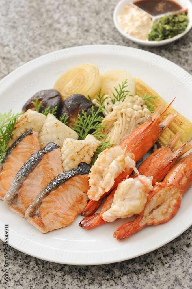 Shrimps, salmon slice, squid grilled, teppanyaki, japanese food Shrimps, salmon slice, squid grilled, teppanyaki, japanese food