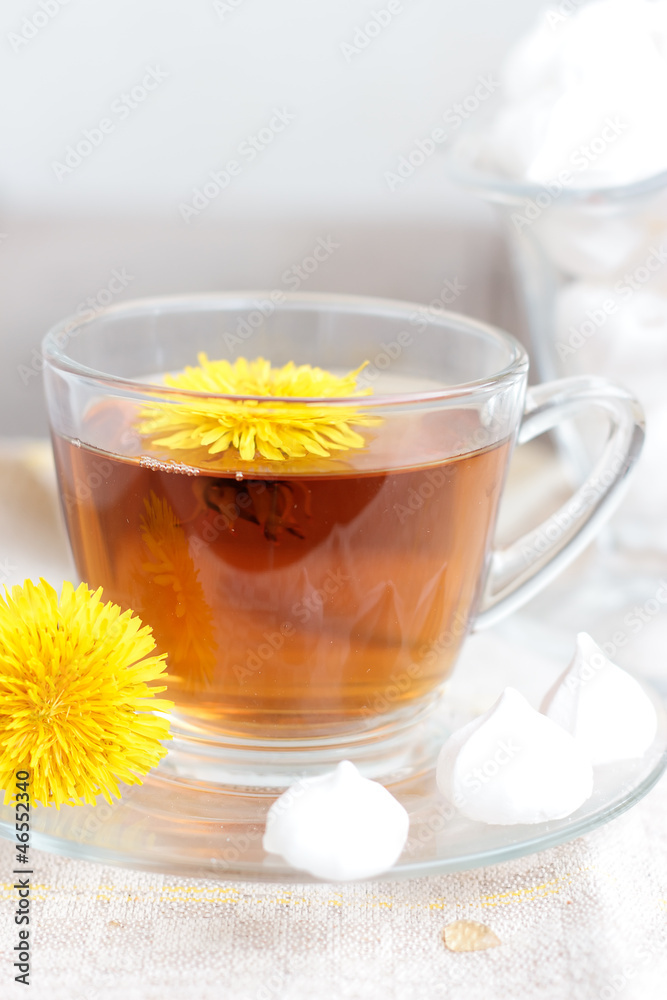 tea in glass cup and flowers