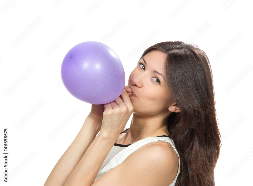 Young happy girl blowing balloons for birthday party Young happy girl blowing balloons for birthday party