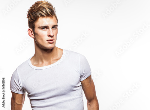 Attractive man wearing T-shirt close up portrait © Unique Vision