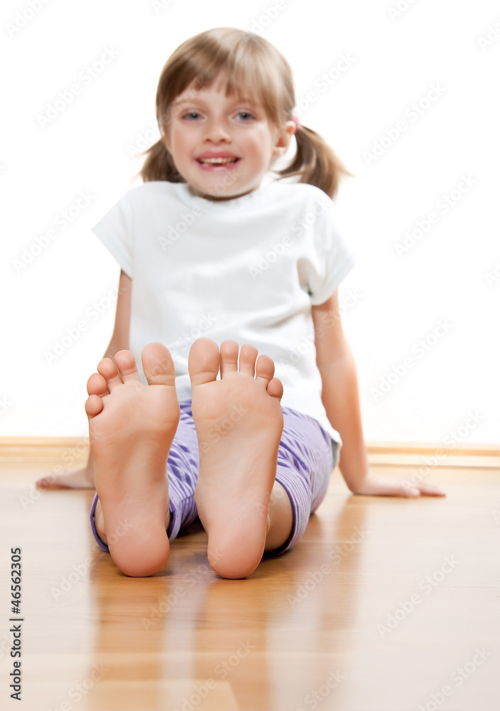 A Little Girl on a Wooden Floor Stock Image - Image of cute, rest: 27553207