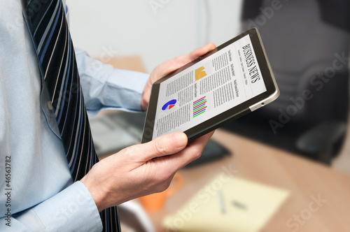 Man holding a digital tablet