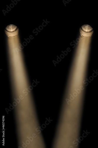 Two yellow spotlights in a smoky atmosphere