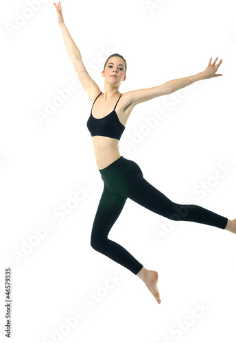 Nice girl in black sportwear jumping
