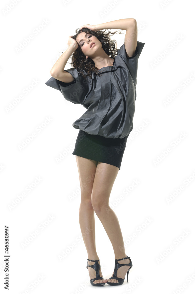 Vogue style fashion model posing in studio Vogue style fashion model posing in studio