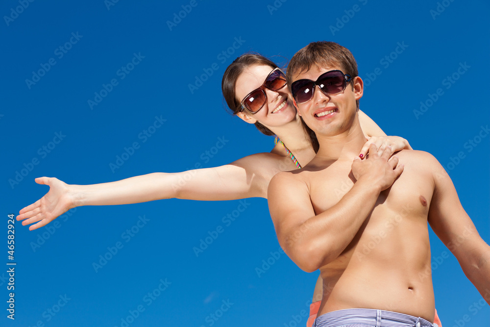 Happy Young Couple Together On The Beach Happy Young Couple Together On The Beach