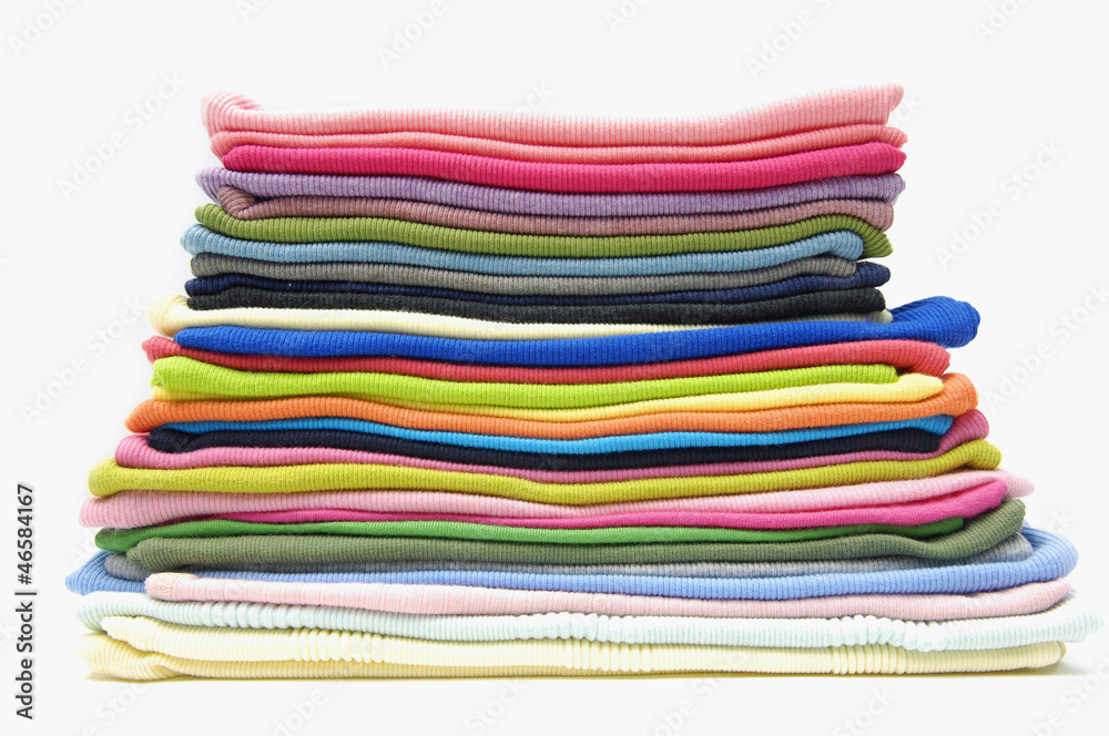 Rainbow laundry. Pile of bright folded clothes