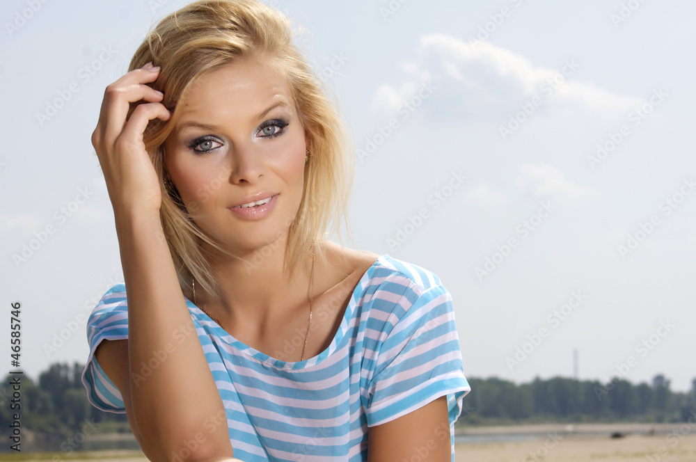 beautiful girl on background blue sky