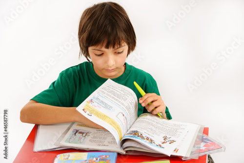 a beautiful boy doing homework