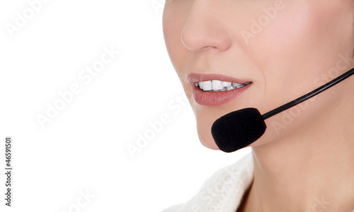 Cheerful call center operator against white background