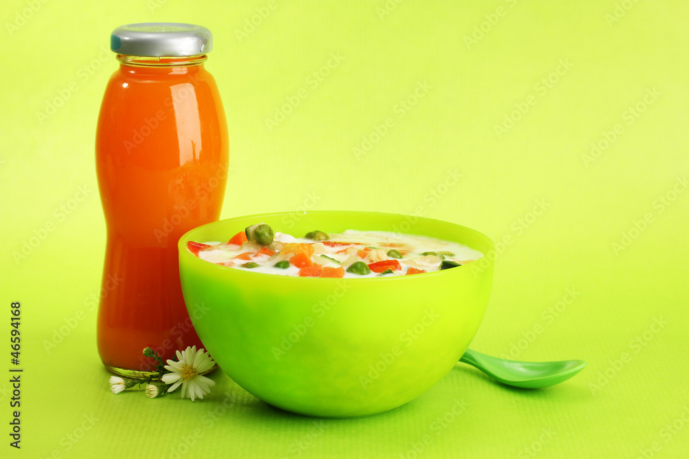 tasty dieting food and bottle of juice, on green background tasty dieting food and bottle of juice, on green background