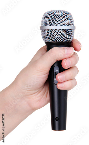 Black microphone in hand isolated on white