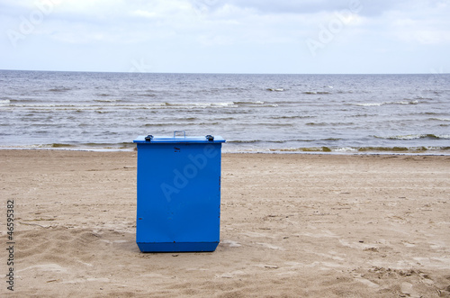metal garbage container on sea resort beach